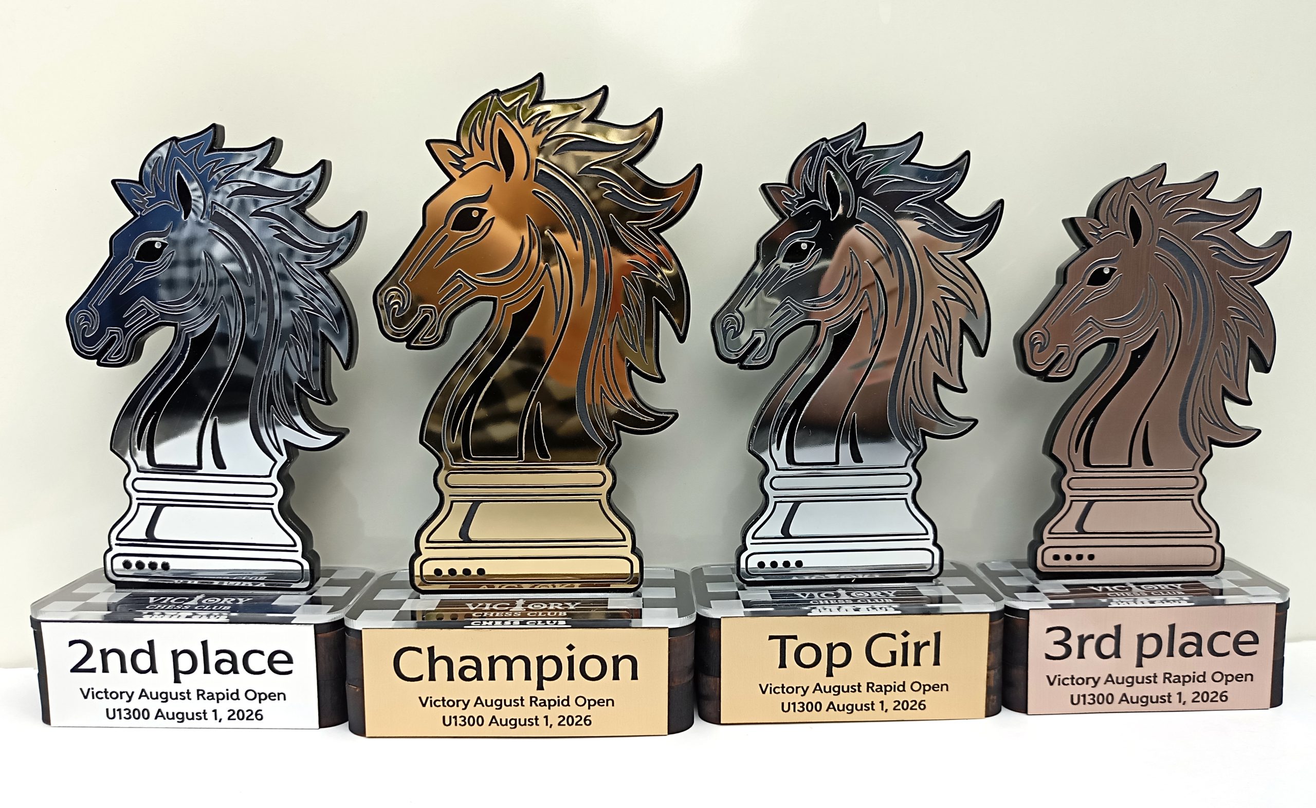 Custom chess knight trophies made by Victory Chess Club for champion, second place, third place and Top Girl awards